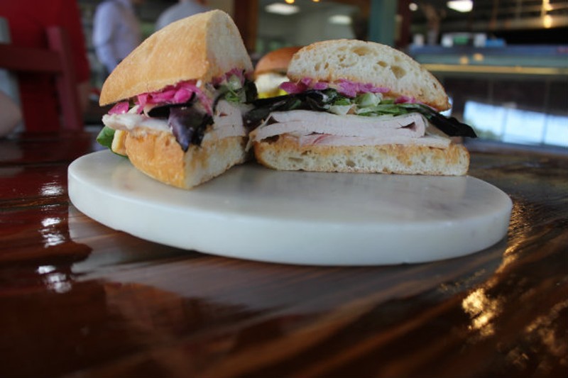 The "Tom Tom," made with turkey, n'duja mayo, Swiss cheese, salad greens and pickled red onions. - Cheryl Baehr
