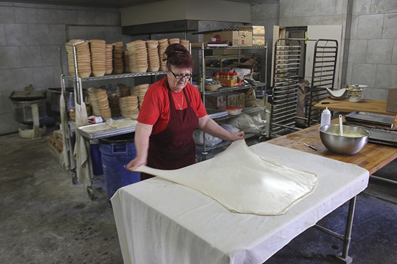 Vahida Mahmutovic stretches the dough at Zlatno Zito Bakery and Deli. - DOYLE MURPHY