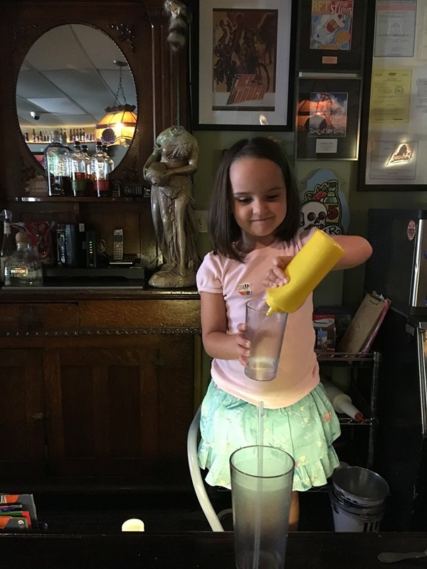 A young bartender at the Waiting Room shows she has the right stuff. - PHOTO BY SHANNON NICHOLS