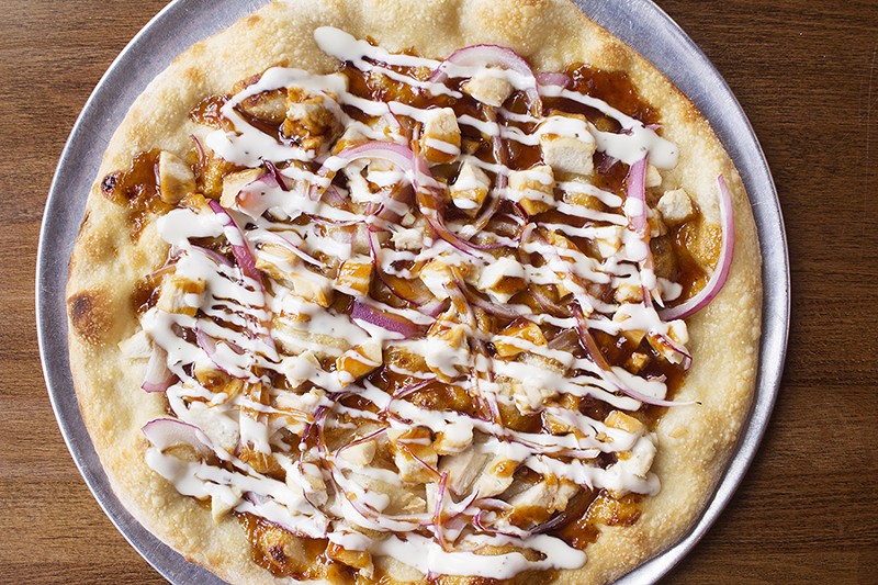 Tapped's BBQ pizza comes with sweet and spicy bourbon-barbecue sauce, grilled chicken, red onions, four-cheese blend and ranch. - PHOTO BY MABEL SUEN