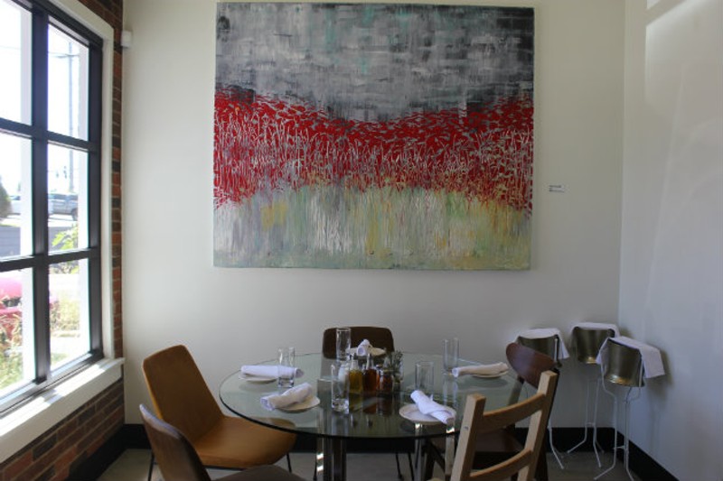 Artwork by co-owner Ted Collier decorates the space. - CHERYL BAEHR