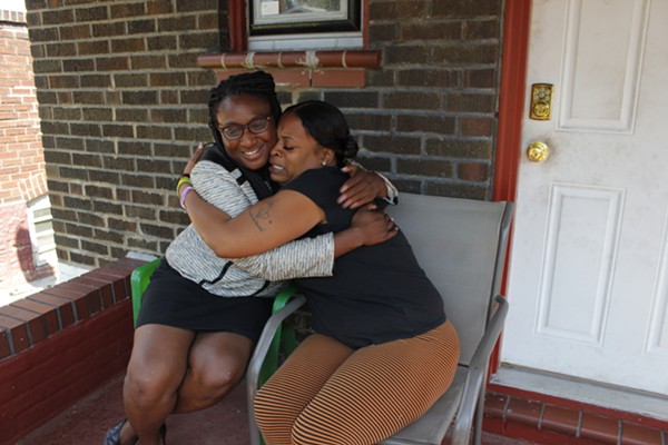 Rhonda Tunstall, right, hugs attorney Kalila Jackson, who helped her through what she says was a frightening ordeal. - PHOTO BY KATIE HAYES