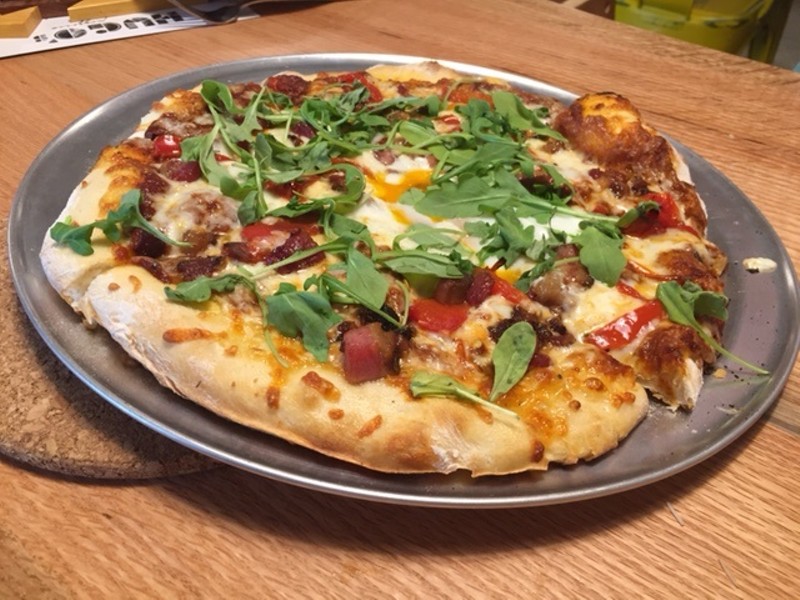 The "Farm Boy" pizza is topped with arugula, roasted red pepper, bacon and an egg. - PHOTO BY SARAH FENSKE