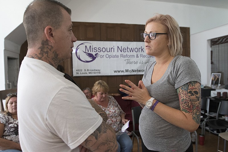 Robert Riley talks to Michelle Charbonnier, a volunteer counselor at the outreach center. - STL-PHOTO