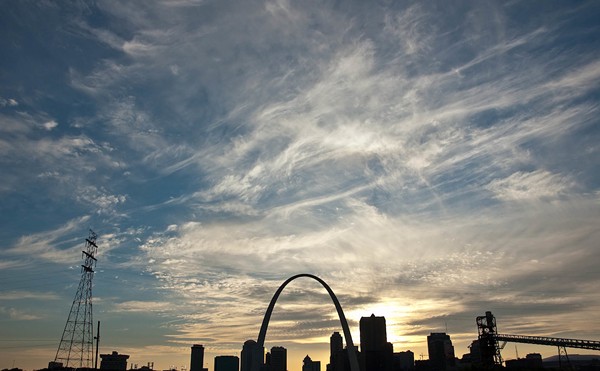A photo shows the St. Louis skyline at sunrise.