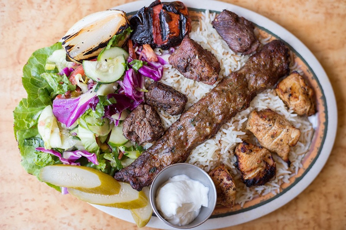 Majeed's mixed-grill entree includes beef kefta, shish tawuk and shish kabob, along with rice and salad.