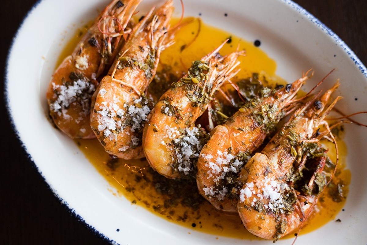 ”Prawns a la Plancha” are served head-on and dressed with garlic, smoked paprika and lemon.