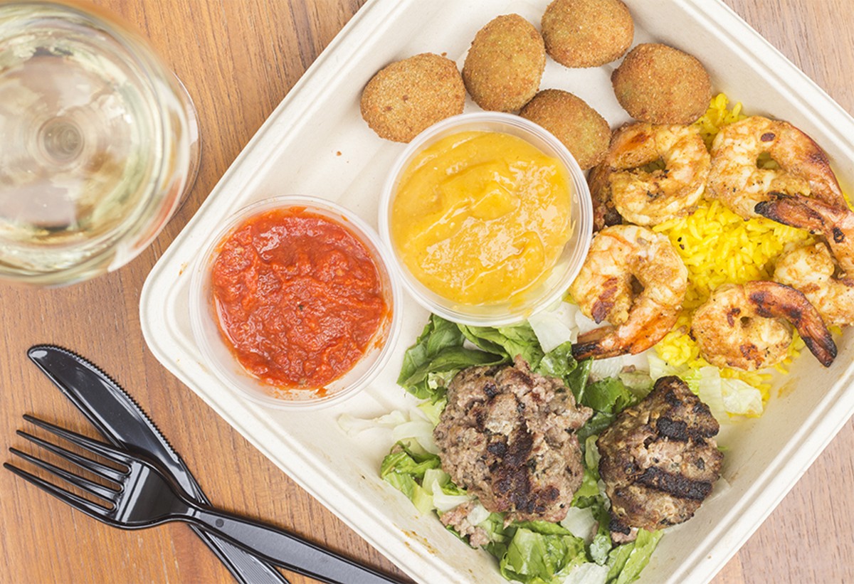 Taze happy-hour appetizers including feta-stuffed fried olives, shrimp and meatballs.