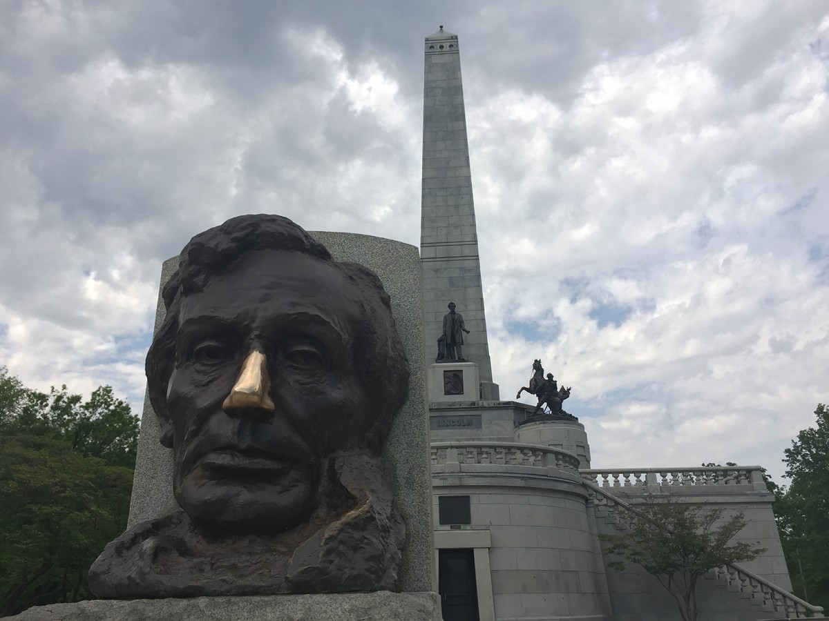 The grubby hands of thousands of tourists have polished Abraham Lincoln's nose to a shine.