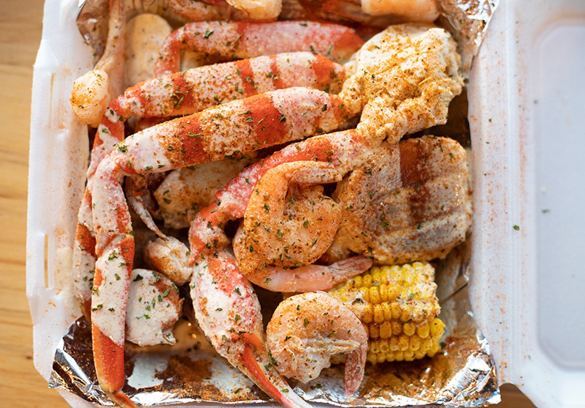 All of Crawling Crab’s shellfish — the lobster, crab and shrimp — are served as part of a platter that includes pieces of mild, Polish-style sausage, hard-boiled eggs, corn and potatoes.