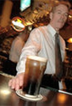 Guinness is good for you: Donovan Buechel serves a perfect 
    pint.