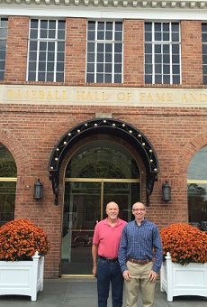 Bill Clevlen (right) with his dad, Rick, in front of the National Baseball Hall of Fame in Cooperstown, New York.
