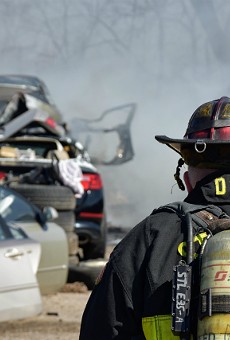 St. Louis firefighters work to put out cars in a salvage yard near Manchester Avenue.