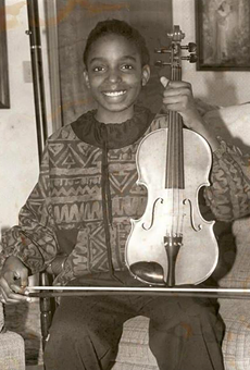 Conaway with her violin after winning a bronze medal at a state music competition at the age of 10.
