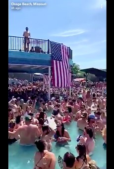 St. Louis County issued a travel advisory after videos (screengrab posted  above) showed crowds of people partying at Lake of the Ozarks bars.
