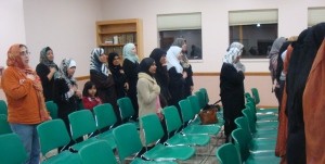 Muslim women take part in the Pledge of Allegiance during last night's event