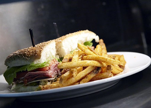 Molly's Club Sandwich and fries. See more photos from Molly's in our slideshow. - PHOTO: STEVE TRUESDELL