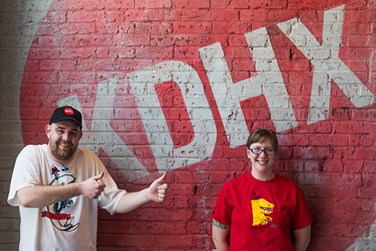 Magnolia Cafe staff, Brad Bufford and Allison Wilson, show off their KDHX swag.