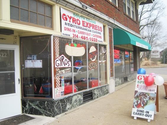 Colorful new graphics adorn the front window of the reopened South Grand Gyro Express. - IAN FROEB