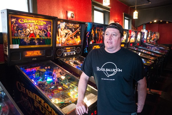 Doc, with some of the bar's pinball machines. - JARRED GASTREICH