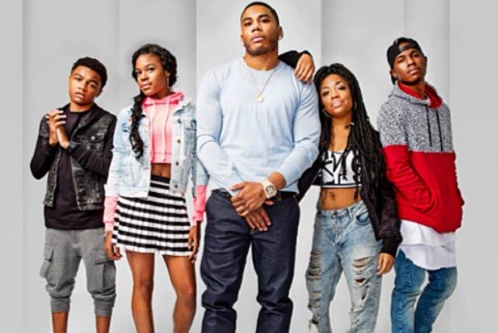 Nelly, with the cast of his upcoming show, a.k.a. his family. - PRESS PHOTO