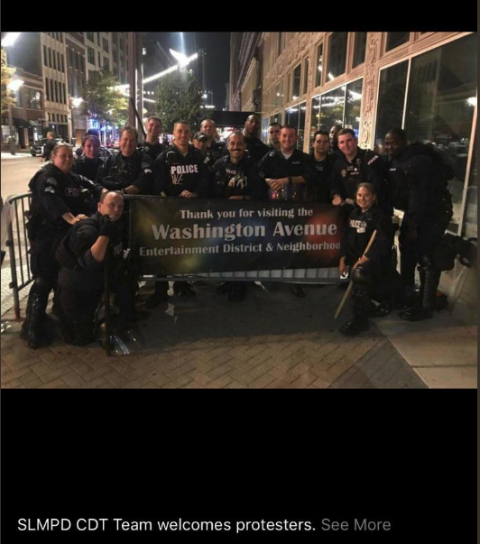 St. Louis riot police pose after kettling protesters in a photo posted to social media and later included in court filings. - COURT FILING