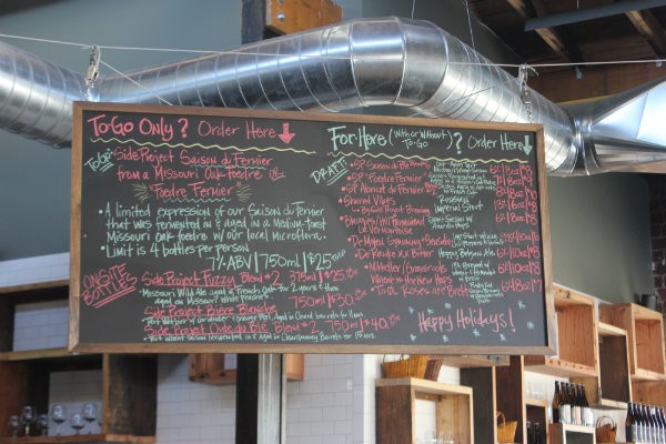A chalkboard menu lists the day's beer offerings. - CHERYL BAEHR