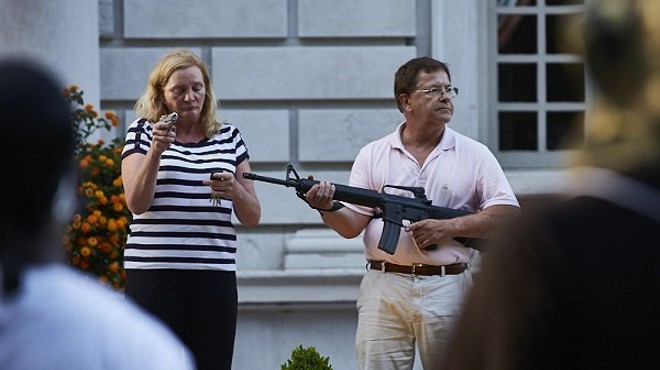 Mark and Patricia McCloskey, seen here on June 28, 2020, committing criminal acts.