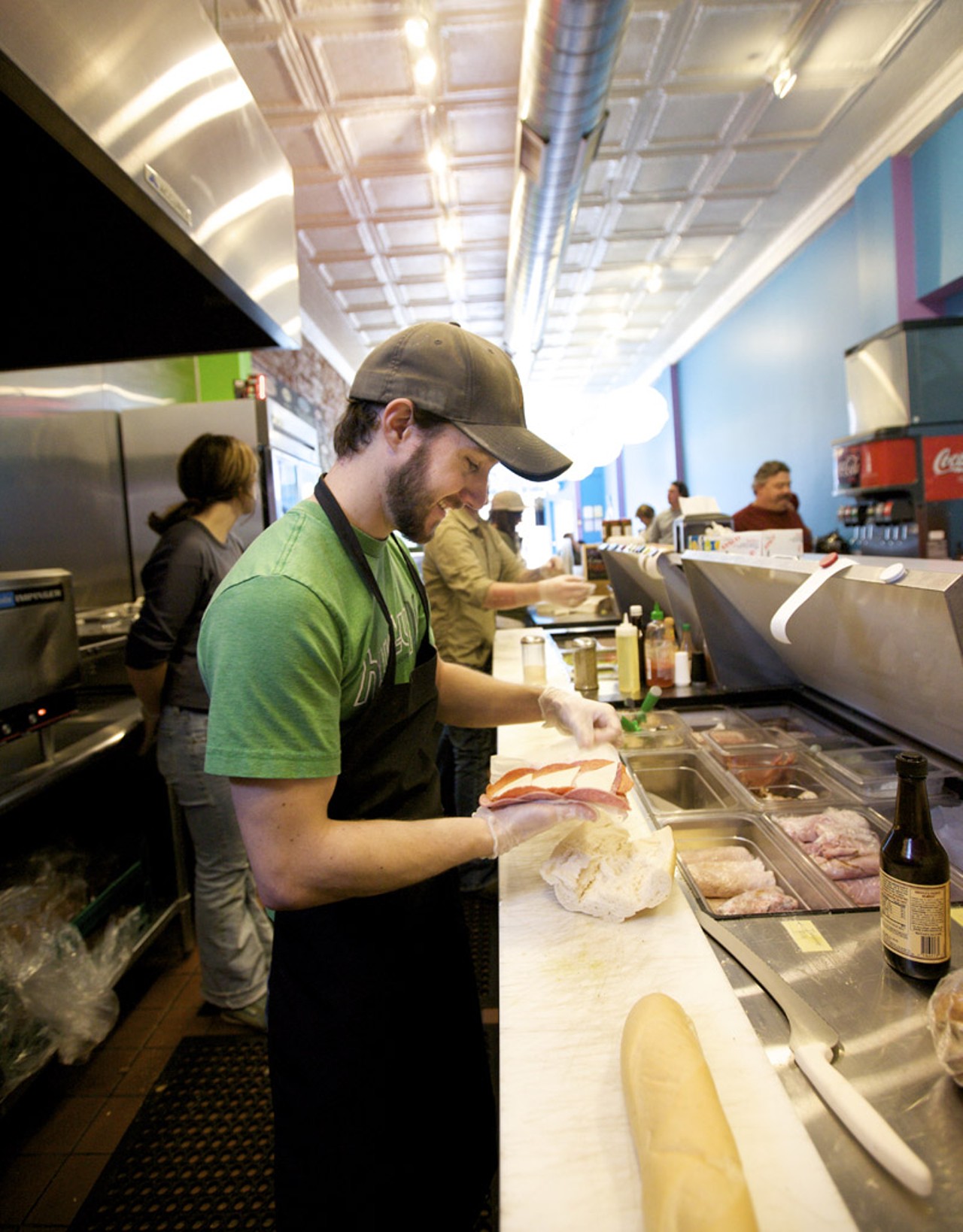 General Manager James Sloan preparing a sandwich at the laid-back Snarf's.