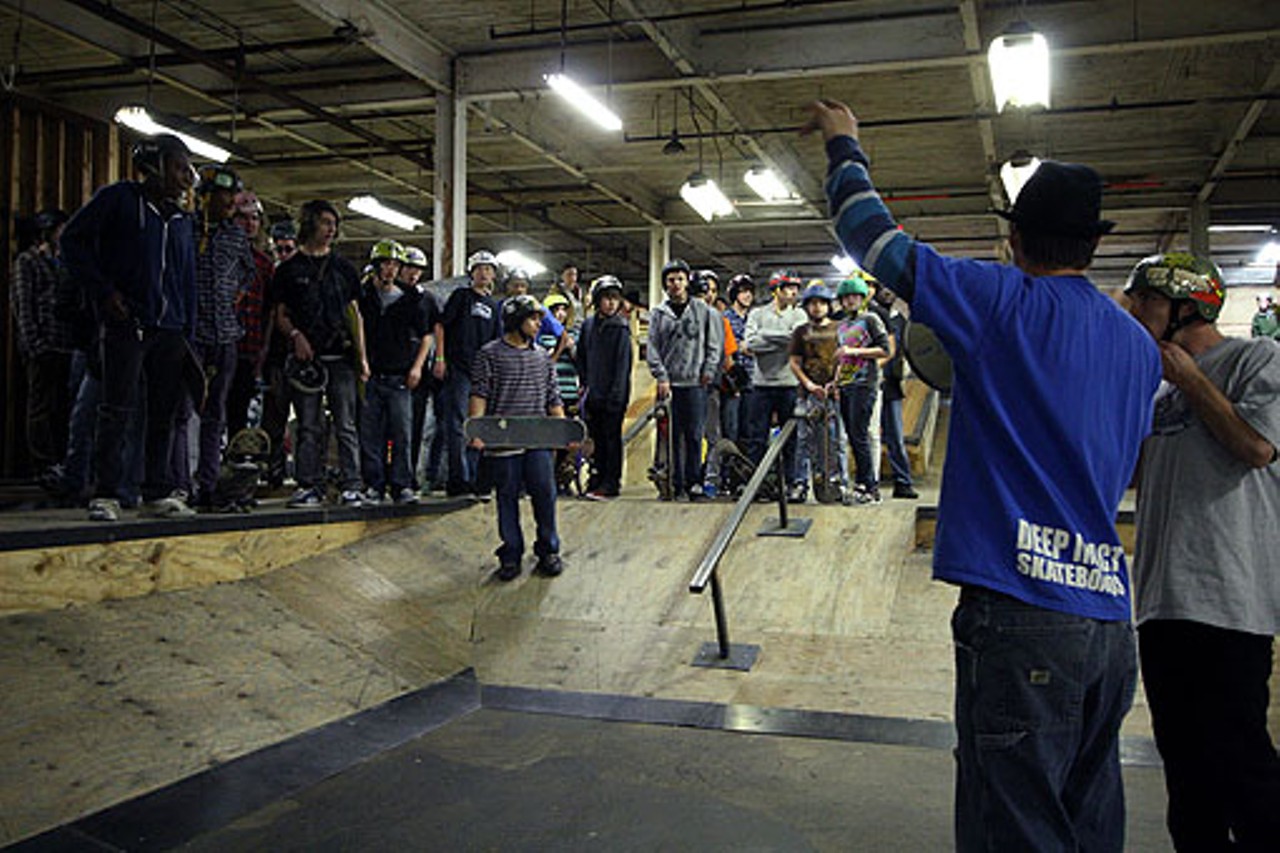 Competition organizer Willis Davenport, right, calls on all skateboarders who  entered in the competition to gather around the street course. A total of 39 skateboarders entered the competition.