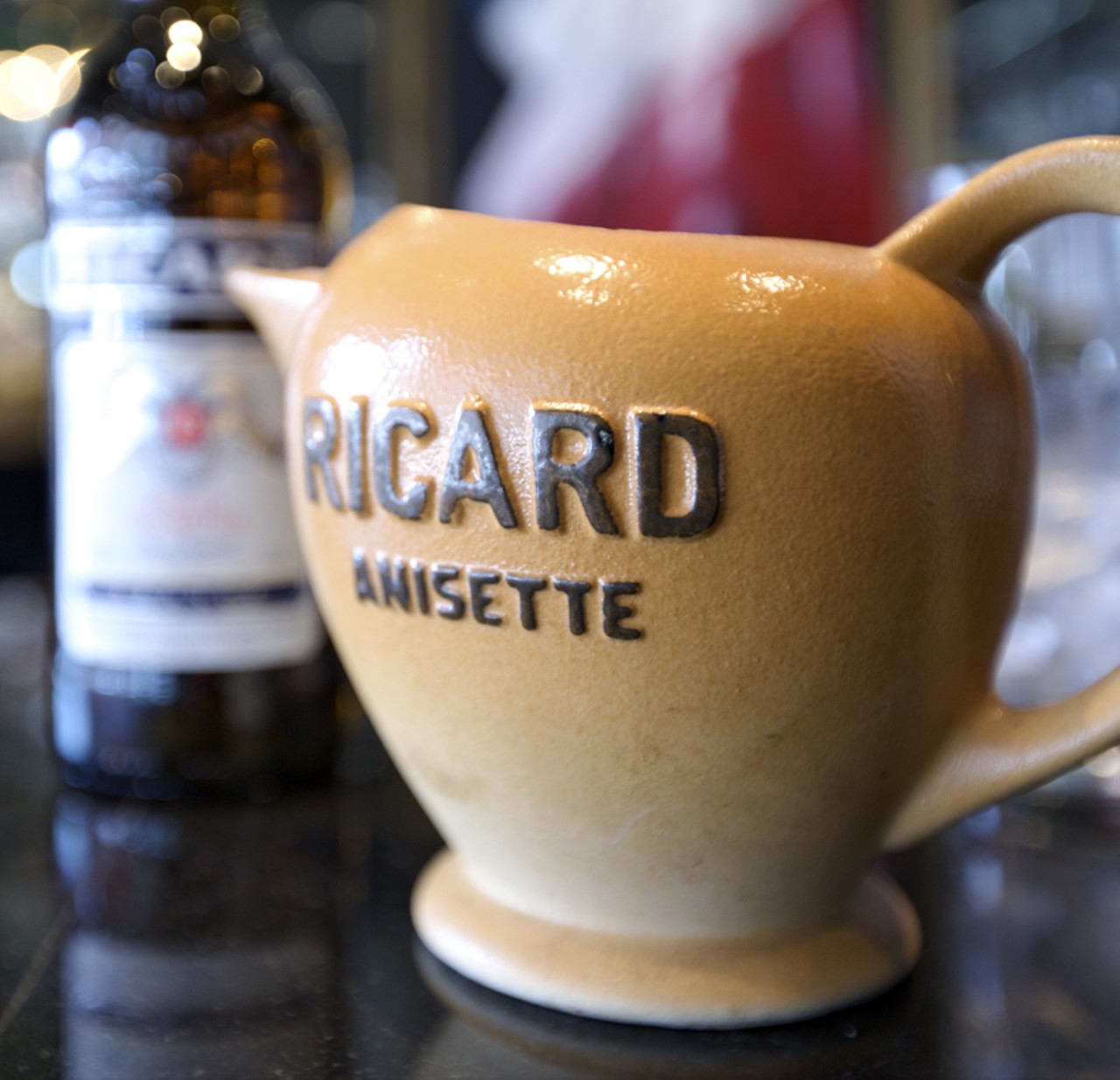 The Ricard Anisette is a vintage pastis that sits at the bar. A pastis is a water pitcher that is served alongside a bottle of Ricard.