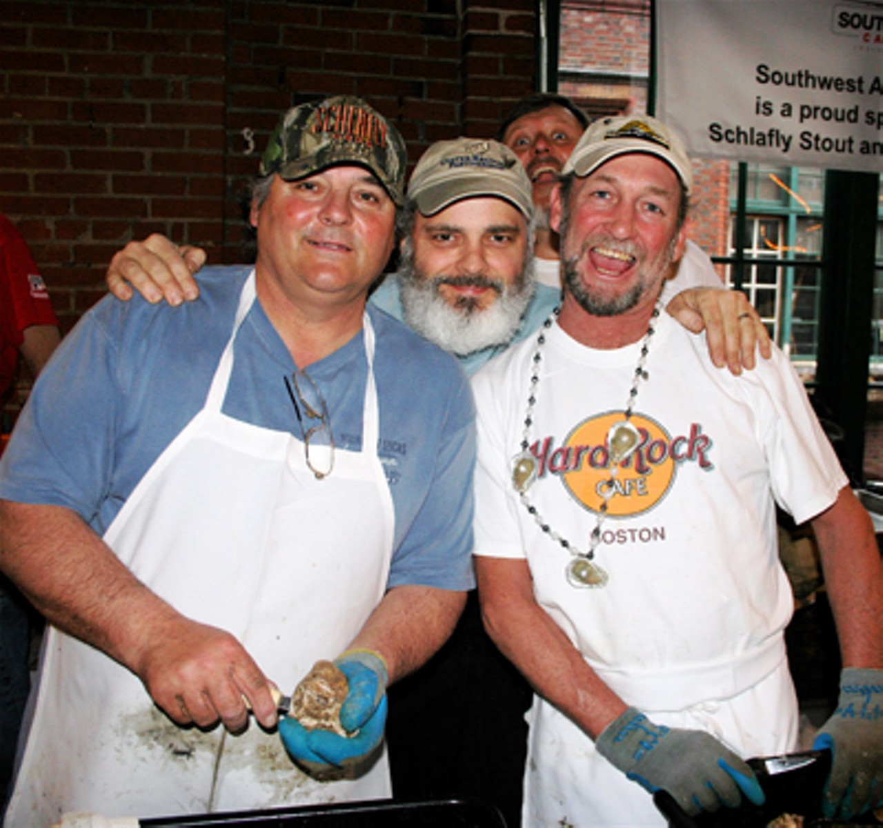 A few of the spirited guest-shucker crew. Notice the excellent oyster bling!