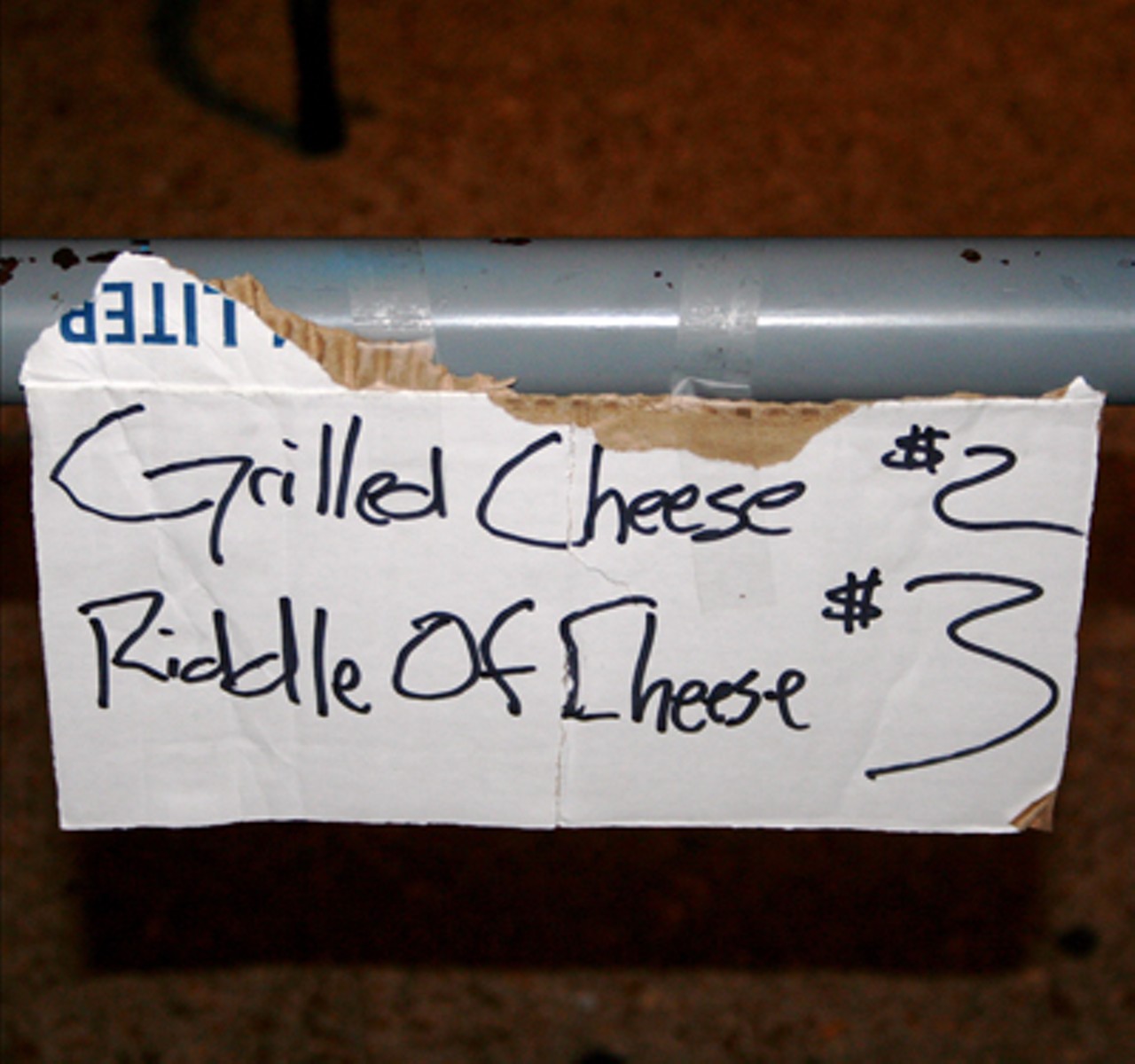 Rock-themed food was being served outside. A Riddle of Cheese is a grilled cheese with a hot dog inside, I am told...