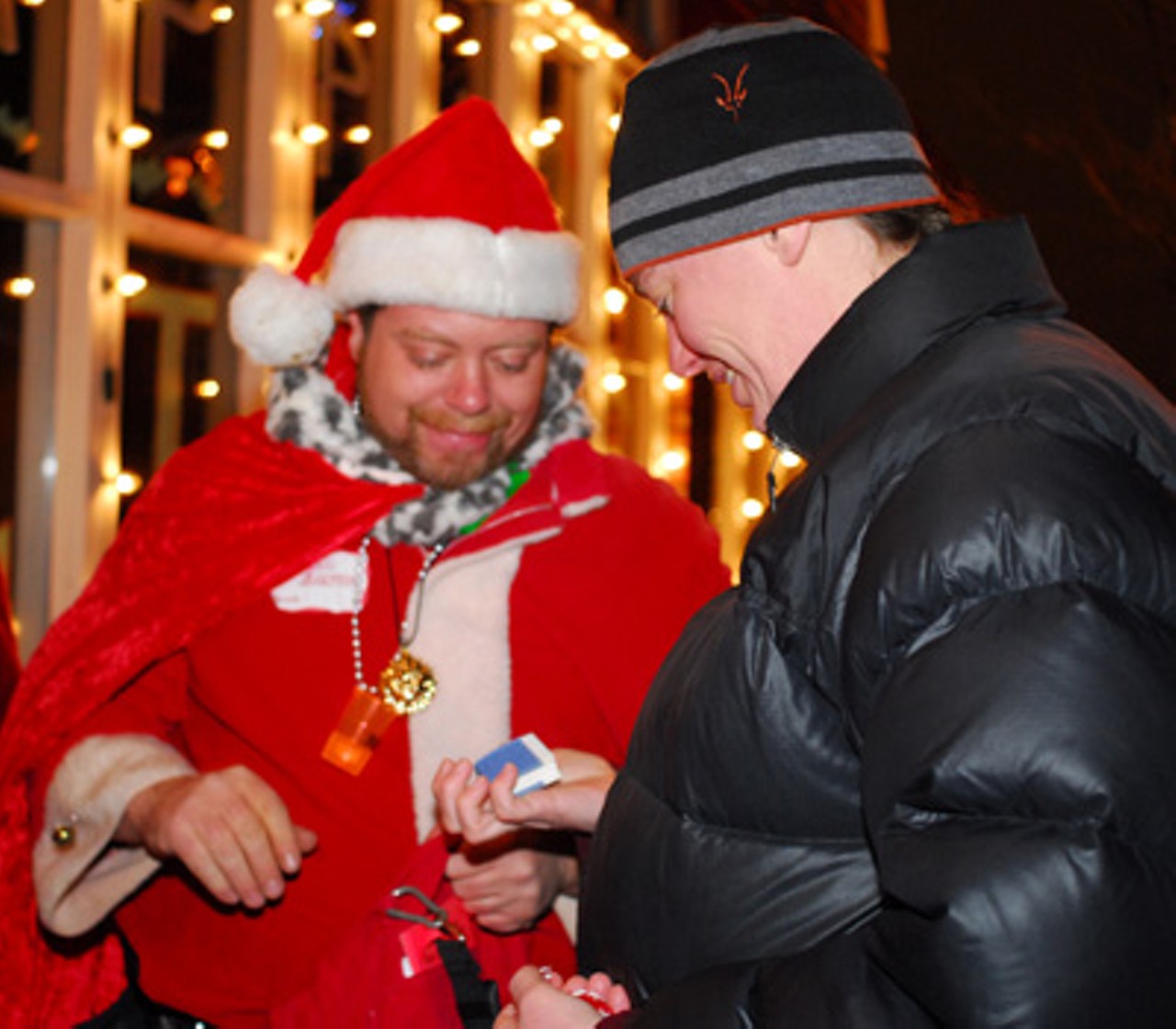 Lohr Barkley passes out presents to a passerby.