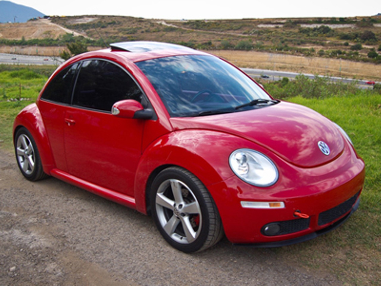 Volkswagen New Beetle
Perhaps the biggest cult car of them all, the Volkswagen Beetle. It went from being known as the "People's Car" to a hip favorite after the introduction of the New Beetle in 1994. After its debut to U.S. buyers in 1998, new generations of drivers have been strangely in love with this bubble of a car. Read Paul Knight's Prius feature: "Wild Rides."
