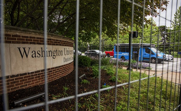 A metal fence surrounds Wash U’s Danforth Campus.