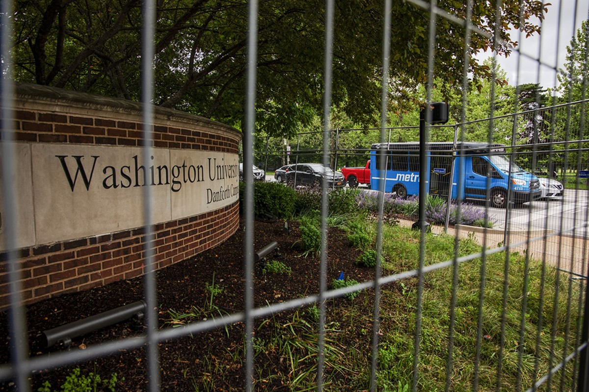 A metal fence surrounds Wash U’s Danforth Campus.