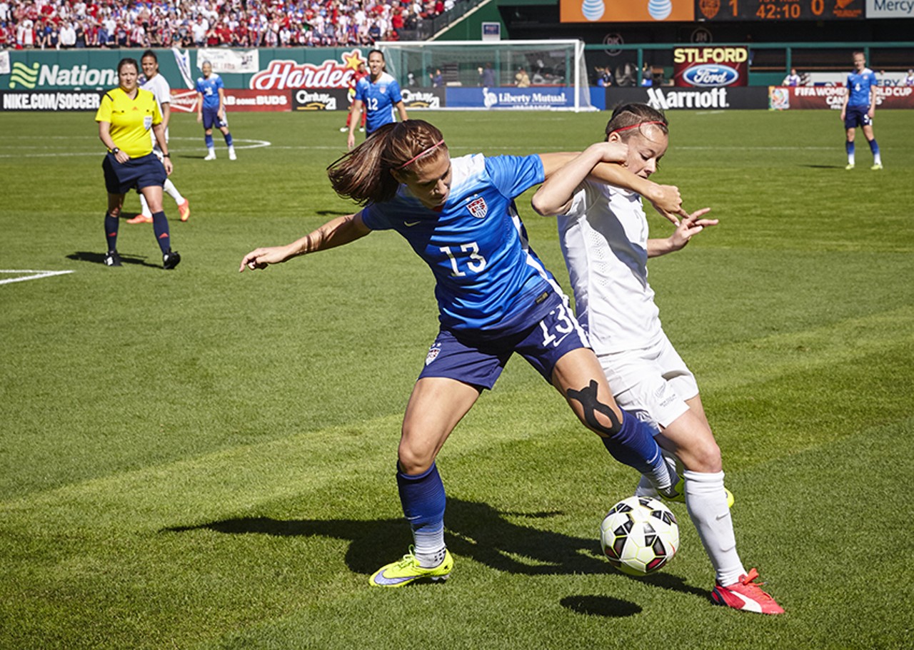 USA's Alex Morgan fights for the ball.