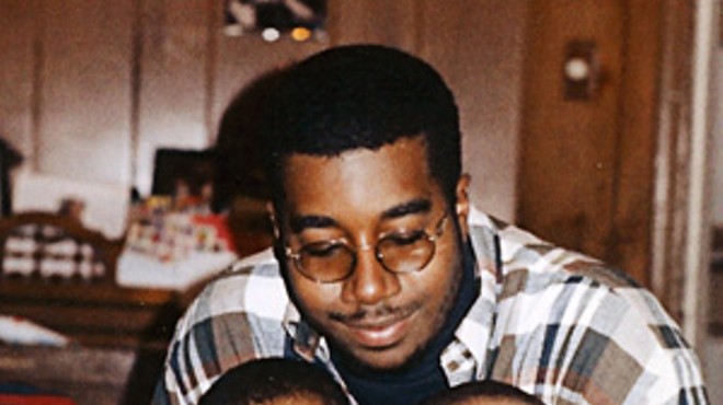 Christian Ferguson (left) and his younger brother, Connor (right), with their father, Dawan Ferguson, in a photo from the mid-1990s. The boys were born a year apart; Christian had citrullinemia but Connor did not.