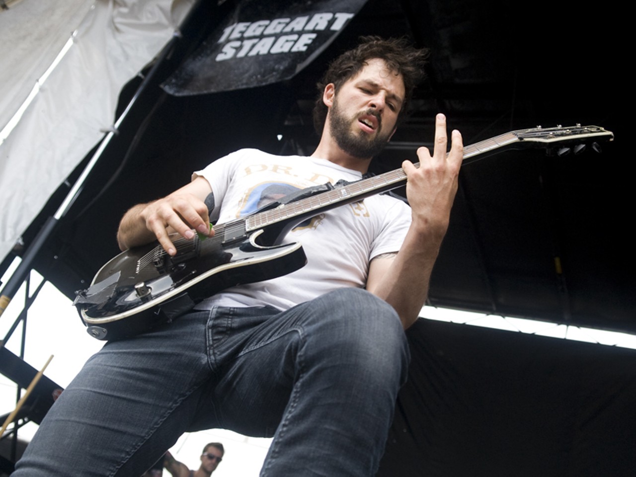 Ben Weinman of Dillinger Escape Plan performing at the 2010 Vans Warped Tour in St. Louis.