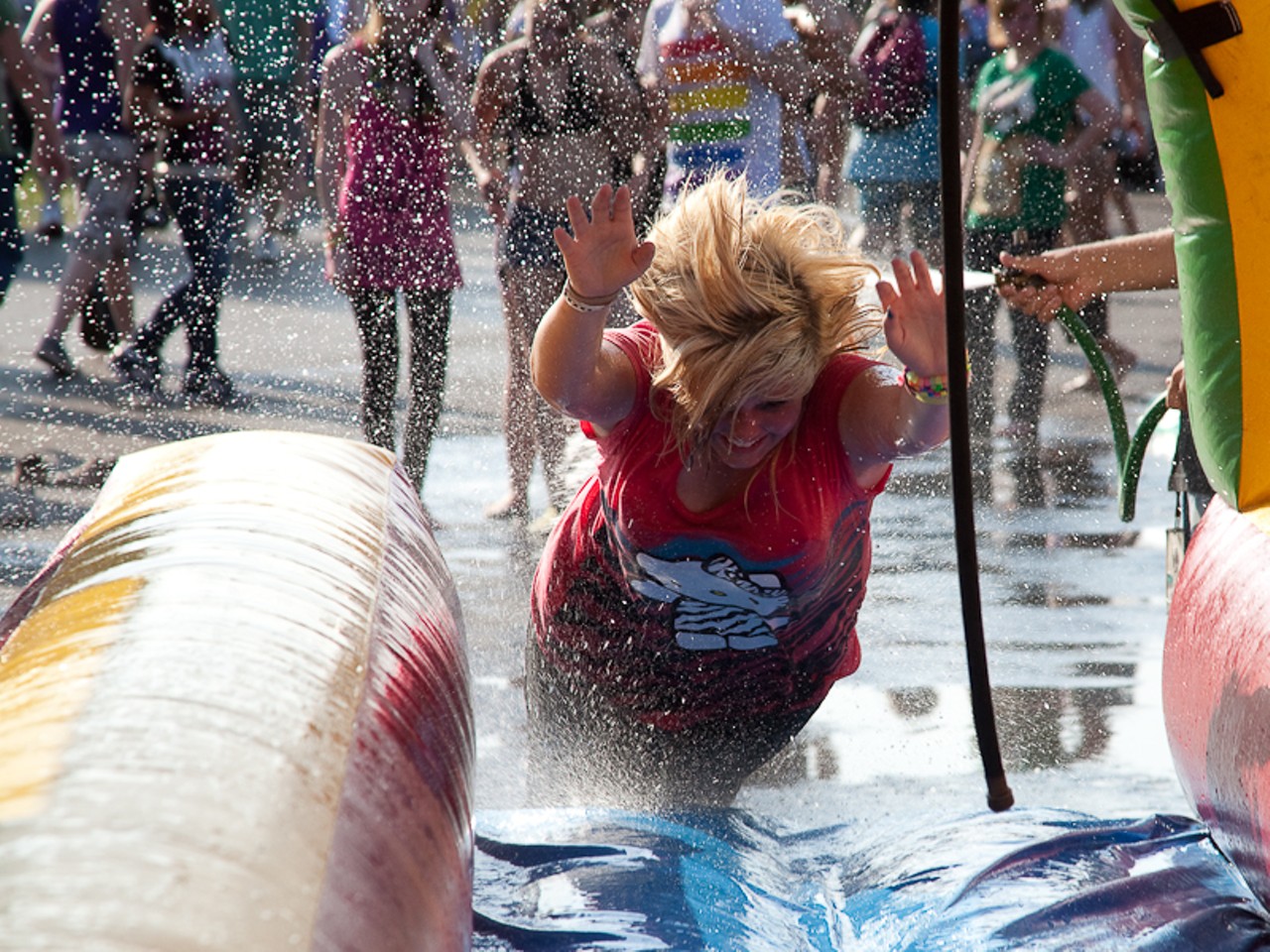 With a heat index of 101, fans would do anything to cool off, even ride an inflatable Slipe 'n' Slide.