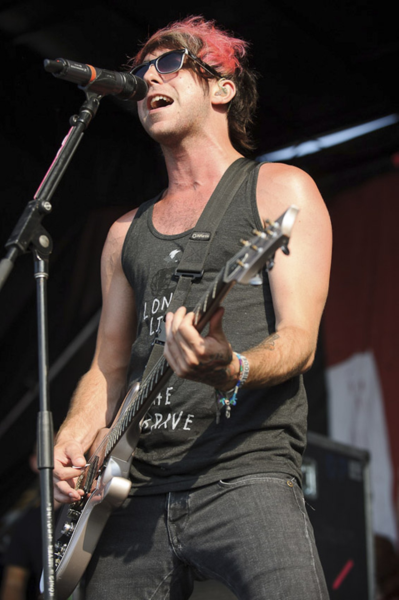 All Time Low performing at Warped Tour at the Verizon Wireless Amphitheater in St. Louis on July 5, 2012.