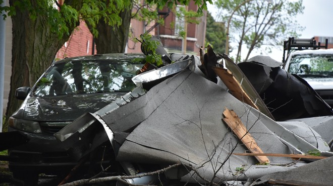 Debris from a roof landed against a car on Indiana Avenue during last night's storm.