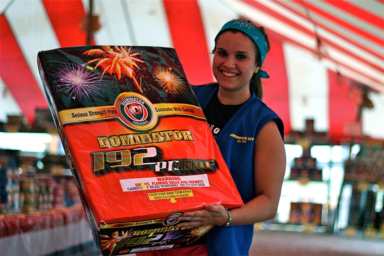 Employee Stormy Coppotelli holds her favorite firework, the Dominator, 192 Proof. Coppotelli has worked at Fireworks City for two years.