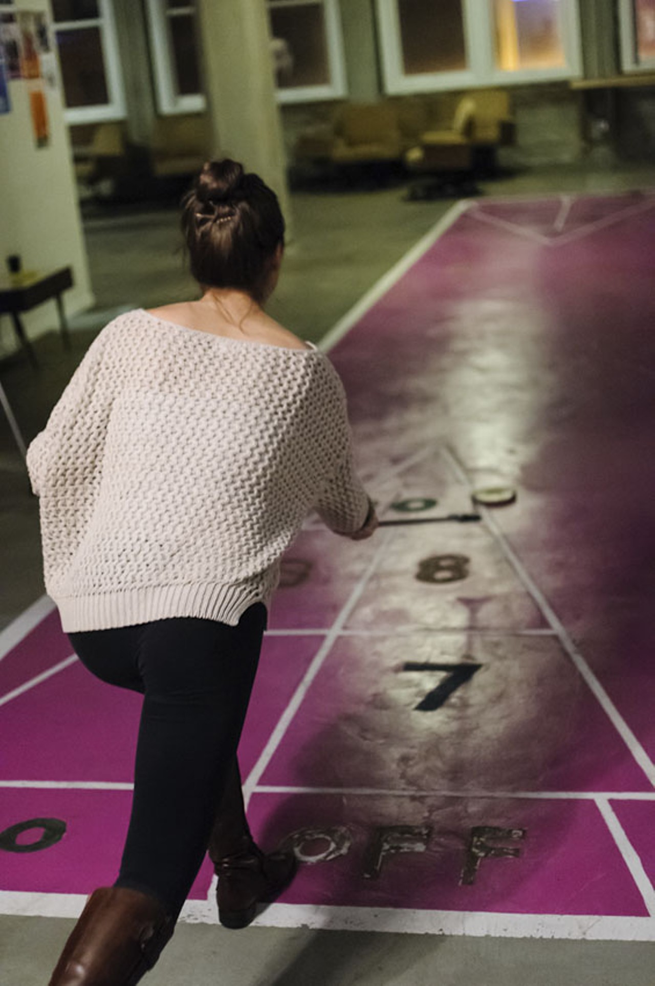 Even while concerts were going on in the next room, some fans found time to play a game of shuffleboard.
